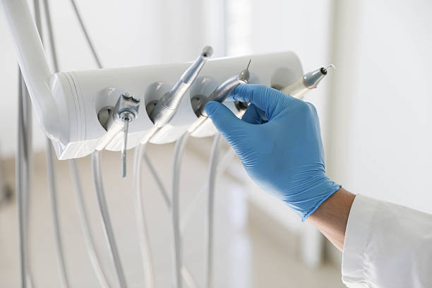 Professional Emergency Dentist technician working in Great River, NY